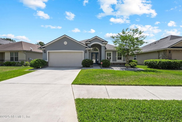 single story home featuring a garage, stucco siding, concrete driveway, and a front yard