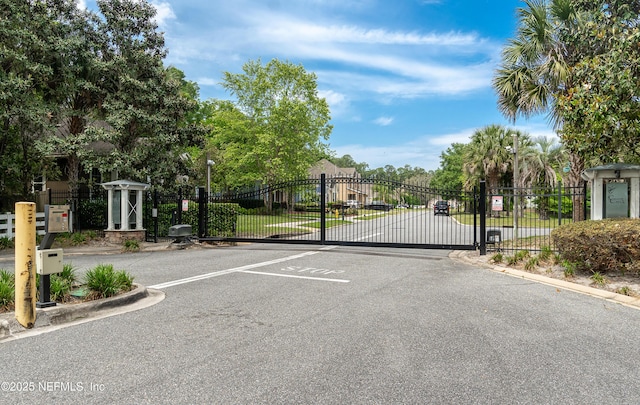 view of gate featuring fence