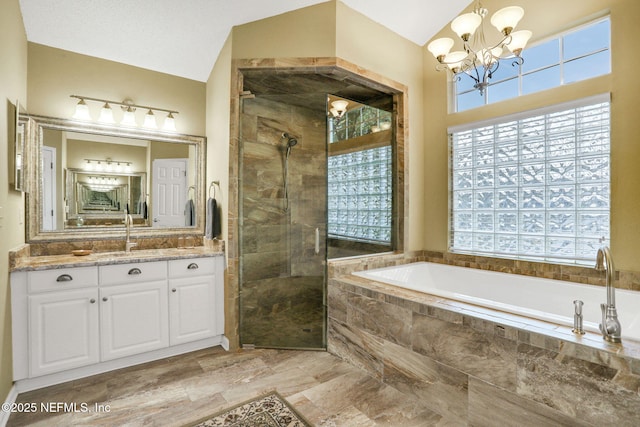 full bathroom featuring a bath, a stall shower, a chandelier, and a healthy amount of sunlight