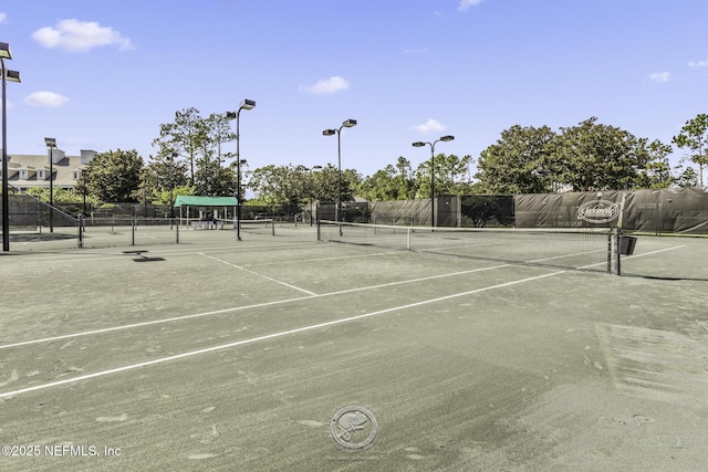 view of sport court with fence