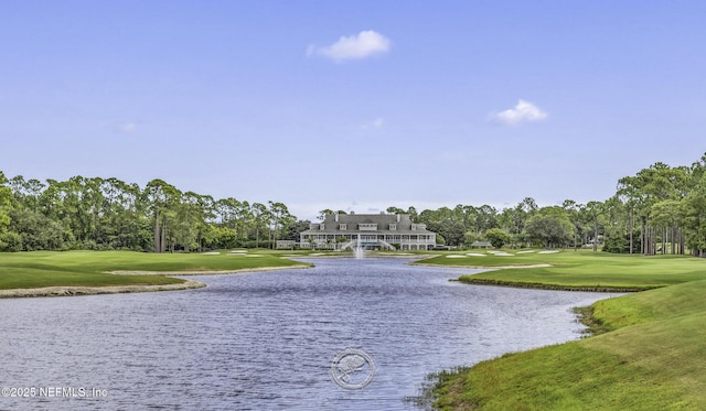 surrounding community featuring a yard, a water view, and view of golf course