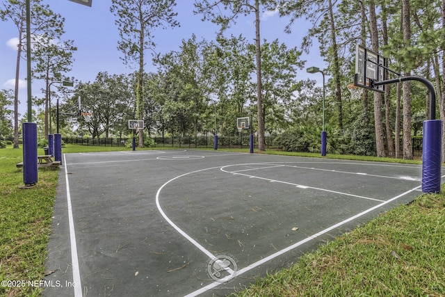 view of basketball court with community basketball court and fence