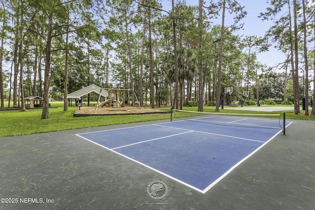 view of sport court featuring a yard, community basketball court, and playground community