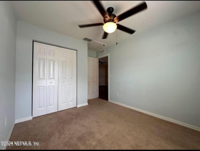 170 Spruce Rd, Ocala, FL 34472 - unfurnished bedroom with attic access, a closet, visible vents, and carpet floors