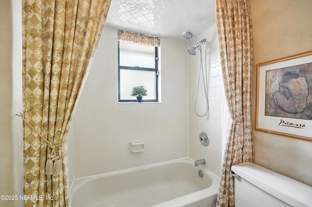full bathroom featuring shower / bath combo with shower curtain and toilet