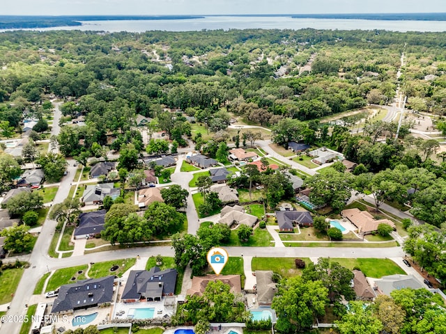 bird's eye view with a residential view, a water view, and a forest view