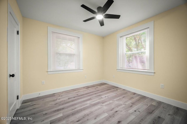 6422 Kathryn Dr, Jacksonville, FL 32208 - empty room with wood finished floors, a ceiling fan, and baseboards