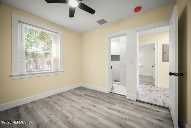 6422 Kathryn Dr, Jacksonville, FL 32208 - unfurnished bedroom with wood finished floors, ensuite bath, and baseboards