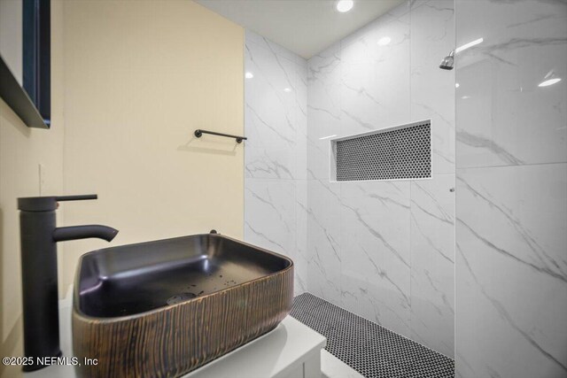 6422 Kathryn Dr, Jacksonville, FL 32208 - bathroom with a marble finish shower, a sink, and recessed lighting