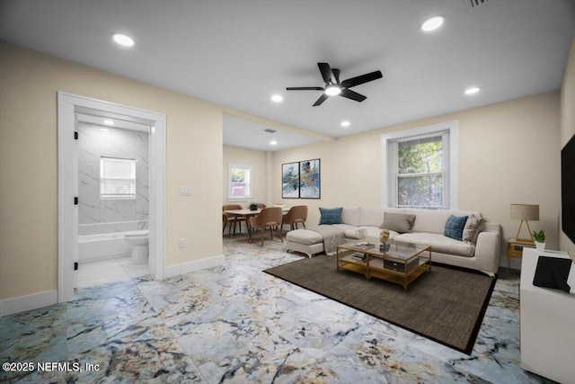 6422 Kathryn Dr, Jacksonville, FL 32208 - living room featuring marble finish flooring, baseboards, ceiling fan, plenty of natural light, and recessed lighting