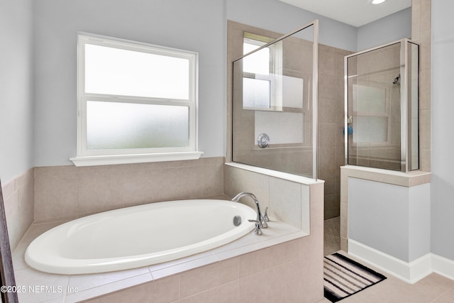 full bath featuring a walk in shower and a garden tub