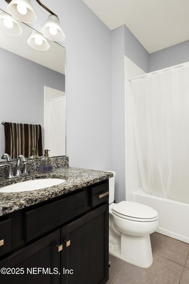 bathroom featuring vanity, tile patterned flooring, toilet, and shower / tub combo