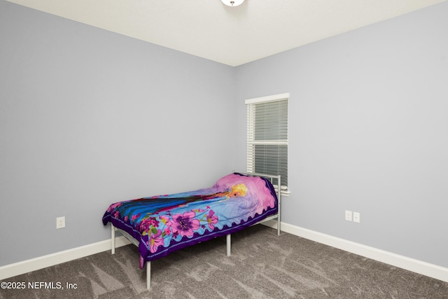 carpeted bedroom featuring baseboards