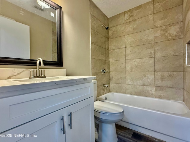 12359 Silent Brook Trl N, Jacksonville, FL 32225 - bathroom with visible vents, toilet, shower / bathing tub combination, wood finished floors, and vanity
