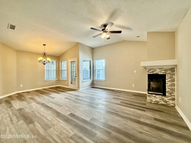 12359 Silent Brook Trl N, Jacksonville, FL 32225 - unfurnished living room with visible vents, wood finished floors, a textured ceiling, and lofted ceiling