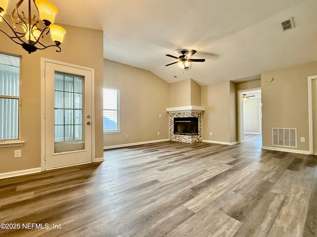 12359 Silent Brook Trl N, Jacksonville, FL 32225 - unfurnished living room featuring visible vents, ceiling fan with notable chandelier, and a textured ceiling