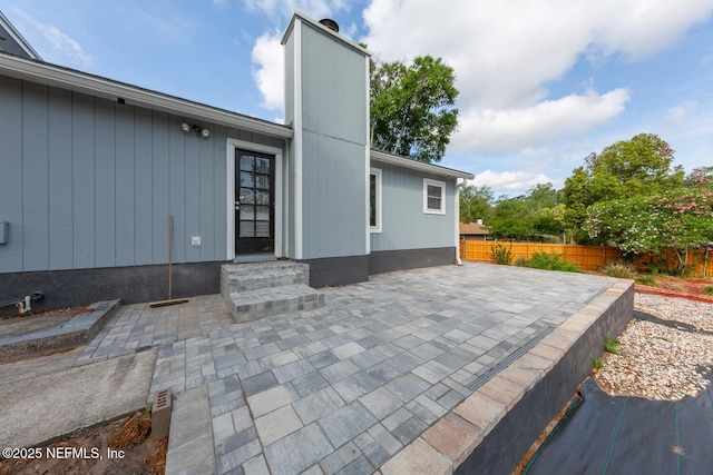 view of patio / terrace featuring fence and entry steps