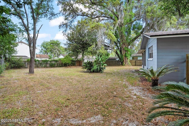 view of yard with a fenced backyard