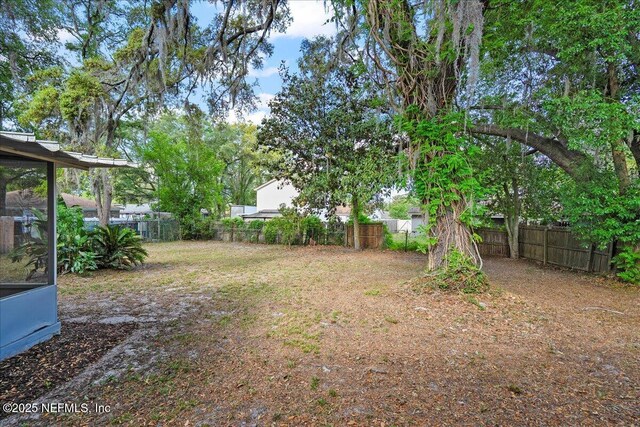 view of yard with a fenced backyard