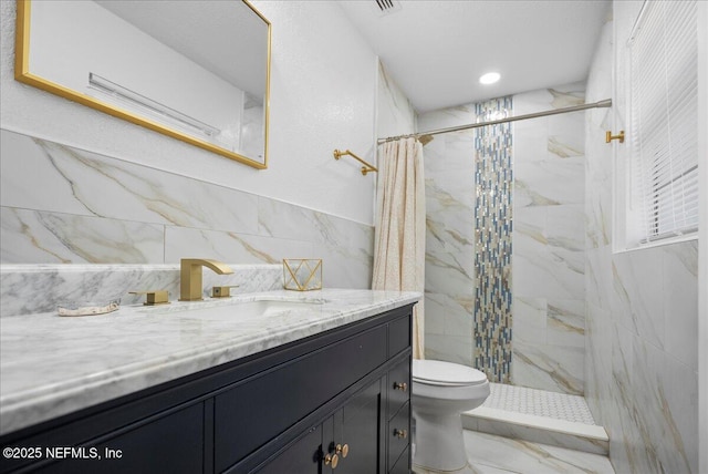 full bath featuring toilet, tile walls, vanity, marble finish floor, and tiled shower