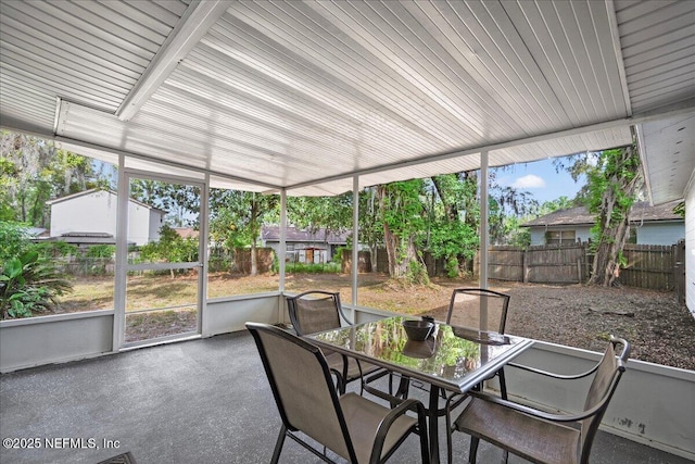 sunroom / solarium with outdoor dining space and plenty of natural light