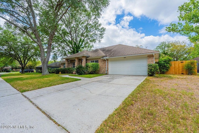 1218 Shallowford Dr E, Jacksonville, FL 32225 - ranch-style house with brick siding, an attached garage, driveway, and a shingled roof