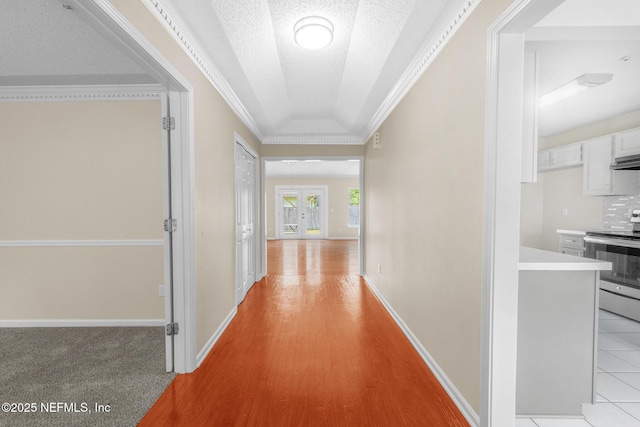 1218 Shallowford Dr E, Jacksonville, FL 32225 - hall with baseboards, crown molding, a textured ceiling, and light wood finished floors