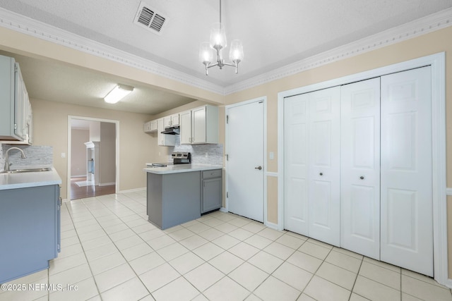 1218 Shallowford Dr E, Jacksonville, FL 32225 - kitchen featuring stainless steel electric stove, a sink, under cabinet range hood, backsplash, and light countertops