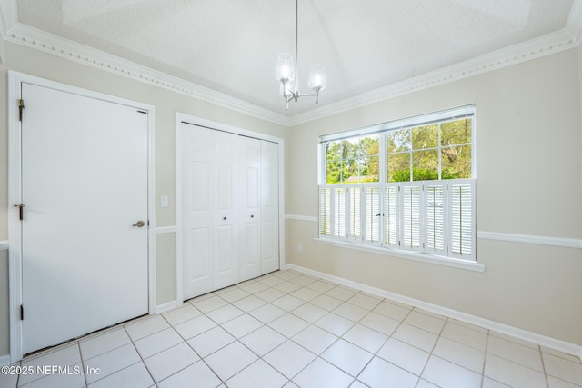 1218 Shallowford Dr E, Jacksonville, FL 32225 - unfurnished bedroom featuring a chandelier, a closet, baseboards, ornamental molding, and light tile patterned floors