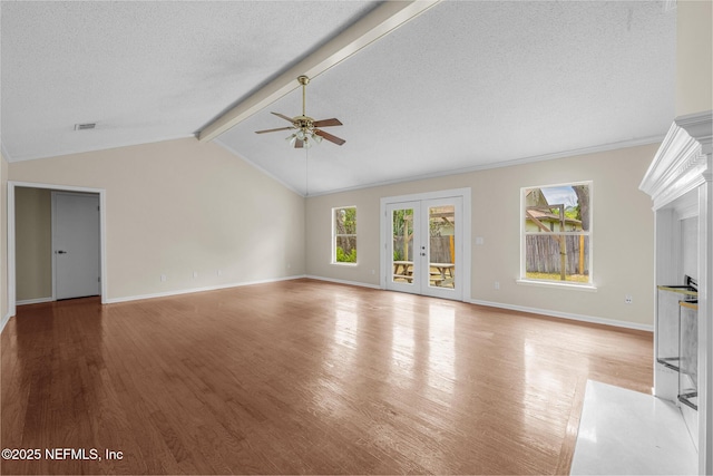 1218 Shallowford Dr E, Jacksonville, FL 32225 - unfurnished living room with ceiling fan, wood finished floors, baseboards, a textured ceiling, and french doors