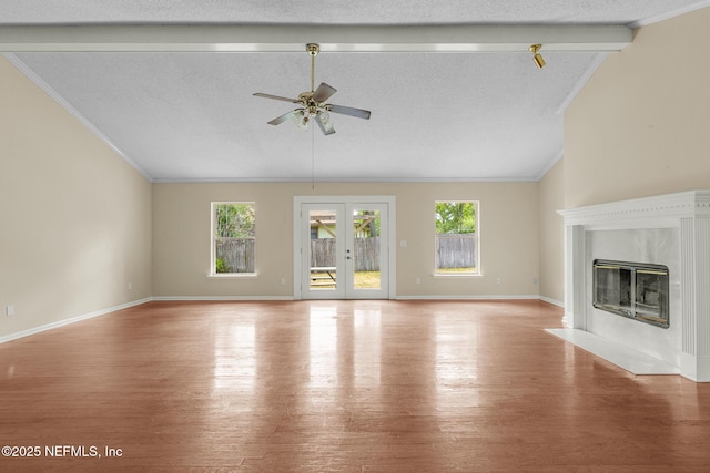 1218 Shallowford Dr E, Jacksonville, FL 32225 - unfurnished living room with wood finished floors, healthy amount of natural light, a ceiling fan, a premium fireplace, and crown molding