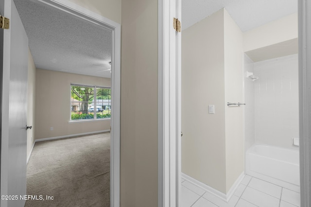 1218 Shallowford Dr E, Jacksonville, FL 32225 - bathroom featuring baseboards, a textured ceiling,  shower combination, and tile patterned floors