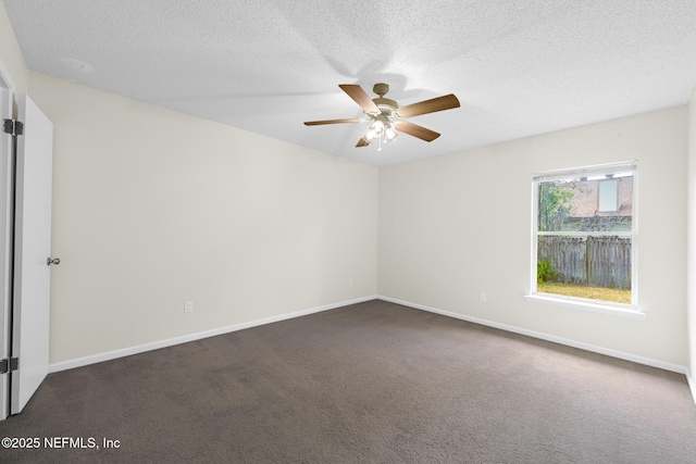 1218 Shallowford Dr E, Jacksonville, FL 32225 - spare room with dark colored carpet, ceiling fan, a textured ceiling, and baseboards