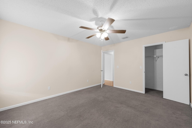 1218 Shallowford Dr E, Jacksonville, FL 32225 - unfurnished bedroom featuring carpet flooring, a textured ceiling, baseboards, ceiling fan, and a closet