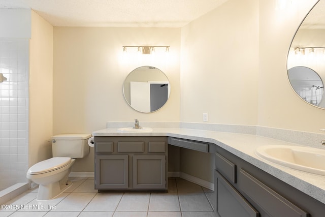 1218 Shallowford Dr E, Jacksonville, FL 32225 - bathroom featuring tile patterned floors, vanity, toilet, and a textured ceiling