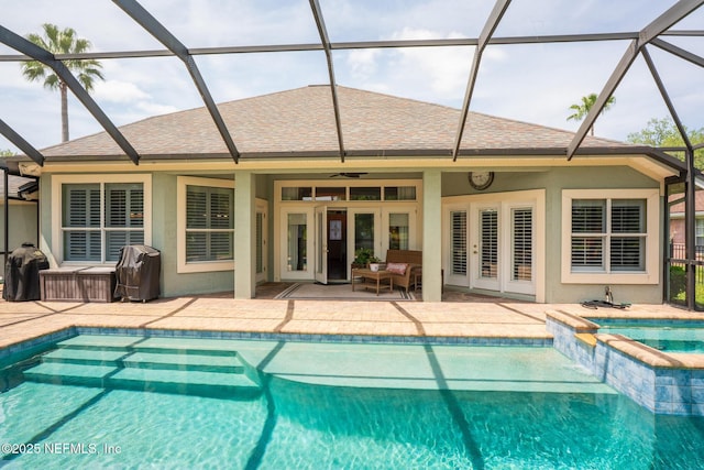 3771 Saltmeadow Ct S, Jacksonville, FL 32224 - view of swimming pool featuring french doors, a patio, a ceiling fan, a pool with connected hot tub, and a lanai