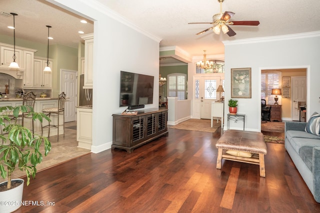 3771 Saltmeadow Ct S, Jacksonville, FL 32224 - living room featuring a chandelier, a ceiling fan, wood finished floors, ornamental molding, and recessed lighting