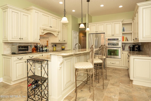 3771 Saltmeadow Ct S, Jacksonville, FL 32224 - kitchen with cream cabinets, open shelves, light stone counters, decorative backsplash, and recessed lighting