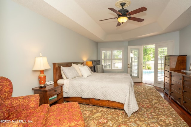3771 Saltmeadow Ct S, Jacksonville, FL 32224 - bedroom with access to outside, a tray ceiling, wood finished floors, and ceiling fan