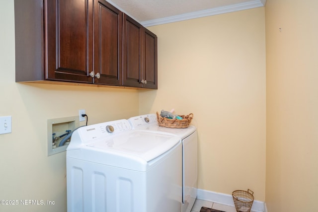 3771 Saltmeadow Ct S, Jacksonville, FL 32224 - laundry room featuring washing machine and clothes dryer, cabinet space, ornamental molding, and baseboards
