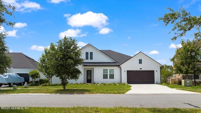 982 Oakland Hills Ave, Middleburg, FL 32068 - modern farmhouse style home with an attached garage, board and batten siding, concrete driveway, and a front lawn
