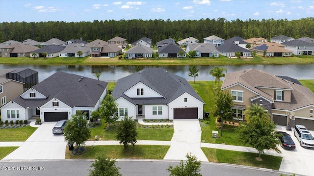 982 Oakland Hills Ave, Middleburg, FL 32068 - aerial view with a wooded view, a water view, and a residential view