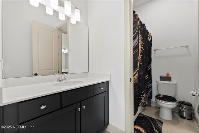 982 Oakland Hills Ave, Middleburg, FL 32068 - full bathroom with vanity, baseboards, tile patterned floors, and toilet