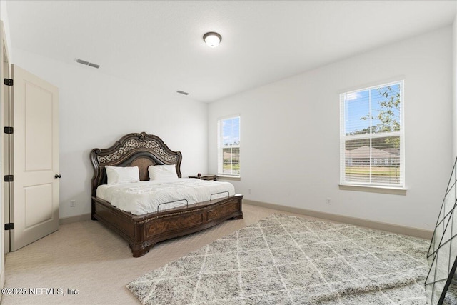 982 Oakland Hills Ave, Middleburg, FL 32068 - bedroom with light colored carpet, baseboards, and visible vents