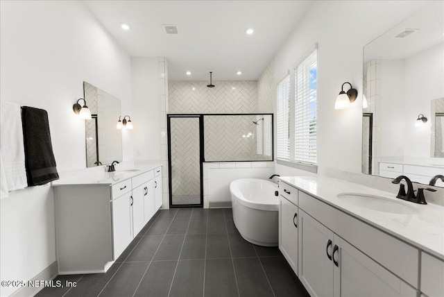 982 Oakland Hills Ave, Middleburg, FL 32068 - bathroom featuring a sink, tile patterned flooring, a stall shower, and visible vents