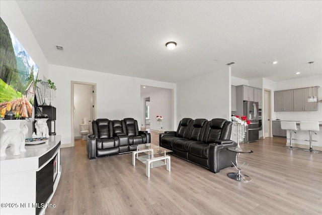 982 Oakland Hills Ave, Middleburg, FL 32068 - living room featuring recessed lighting, light wood-type flooring, and visible vents