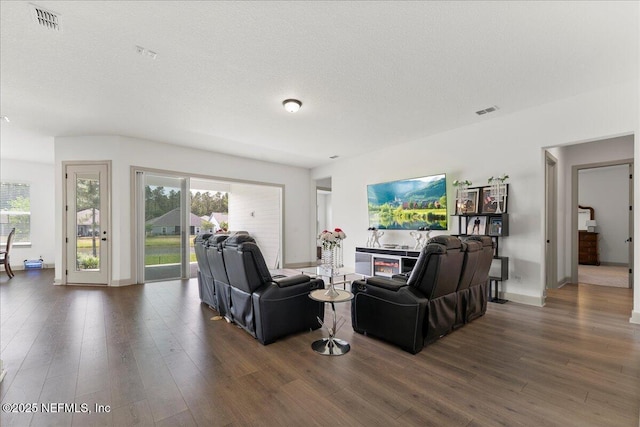 982 Oakland Hills Ave, Middleburg, FL 32068 - living room with baseboards, a textured ceiling, wood finished floors, and visible vents