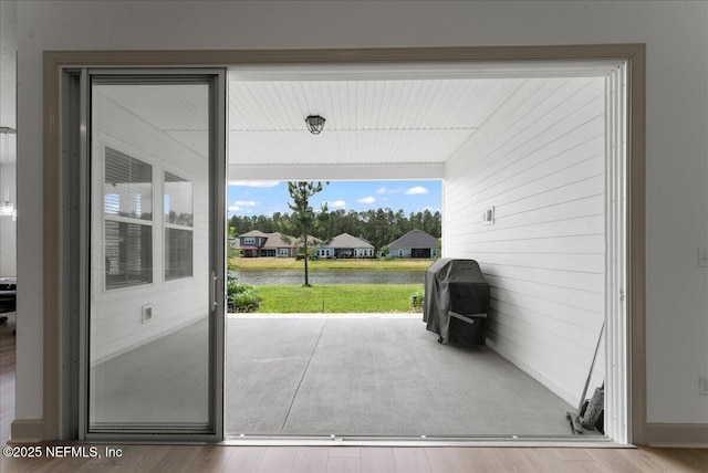 982 Oakland Hills Ave, Middleburg, FL 32068 - entryway with a water view, wood walls, and wood finished floors