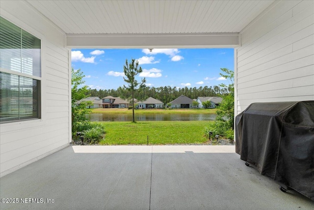 982 Oakland Hills Ave, Middleburg, FL 32068 - view of patio / terrace featuring a water view, a residential view, and a grill