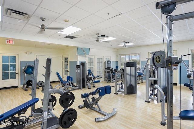 982 Oakland Hills Ave, Middleburg, FL 32068 - workout area with visible vents, wood finished floors, a paneled ceiling, french doors, and a ceiling fan